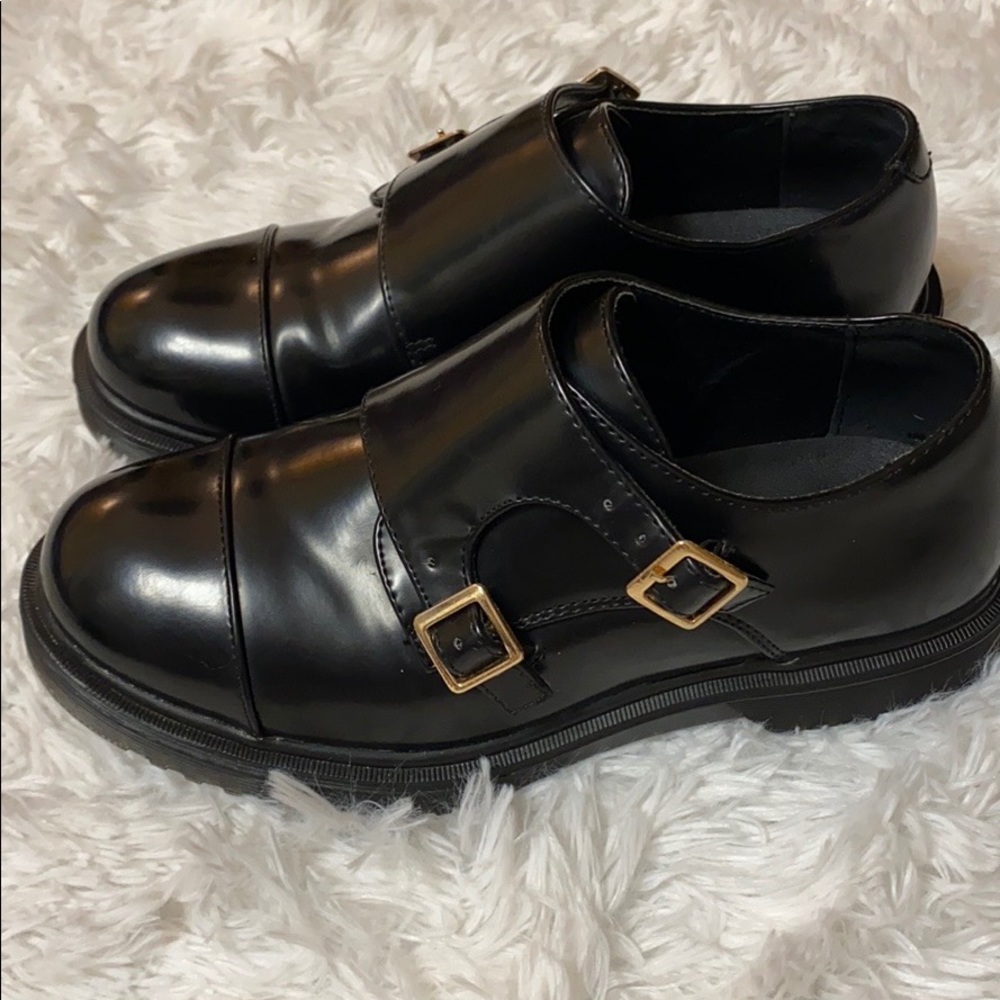Women’s black Electric Karma buckle shoes